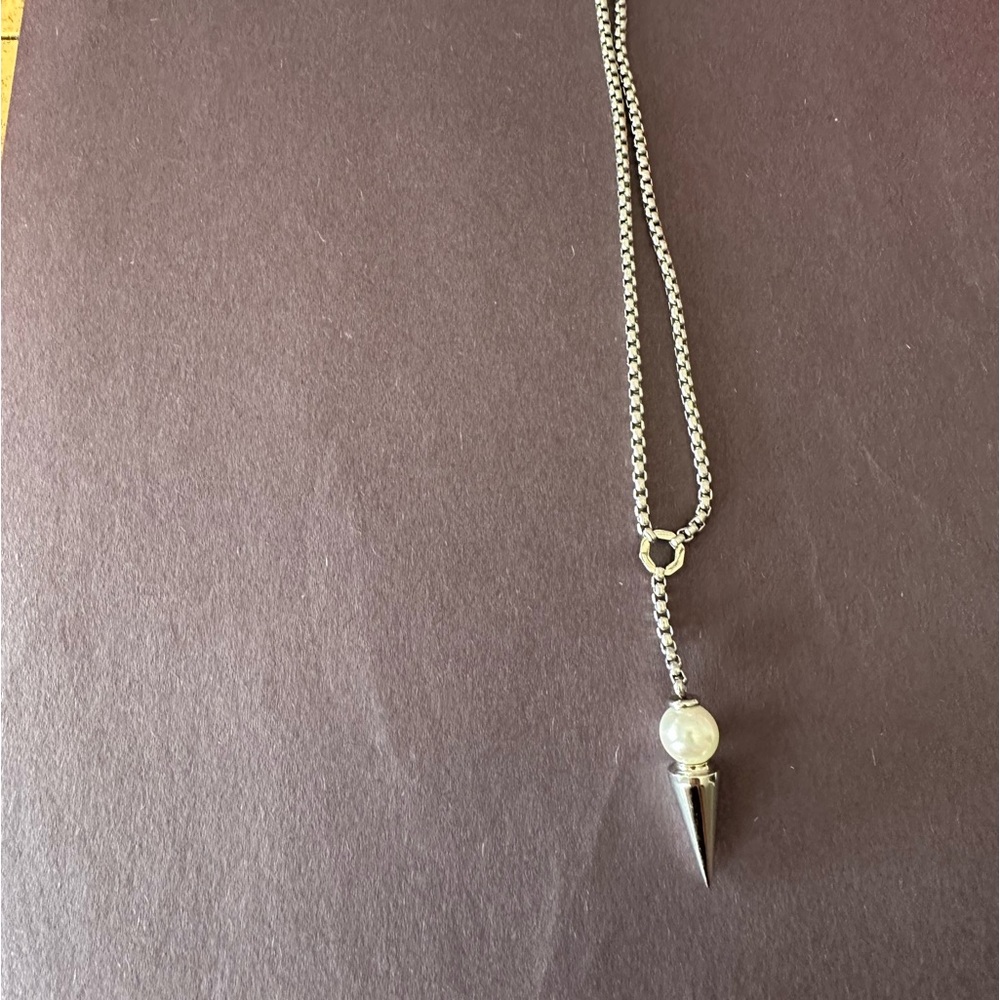 Costume jewelry silver necklace with silver spike and iridescent ball pendant